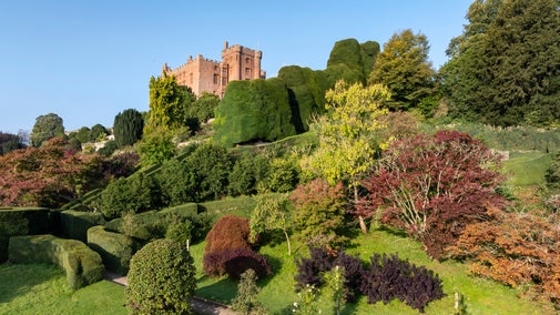 Powis Castle on a hill top, with autumn landscaped gardens
